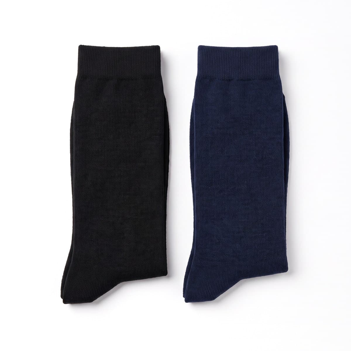 Two pairs of knee-high compression socks, one black pair and one navy pair, folded side by side