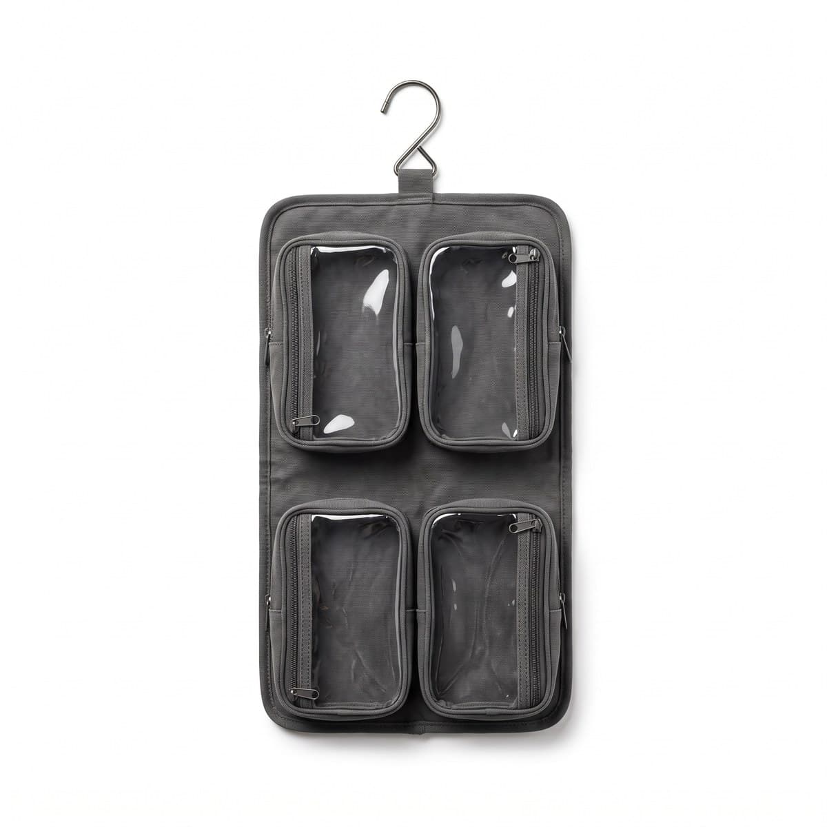 A slate hanging toiletry kit opened flat to show four clear-topped zip pockets, its swivel hook folded out at the top